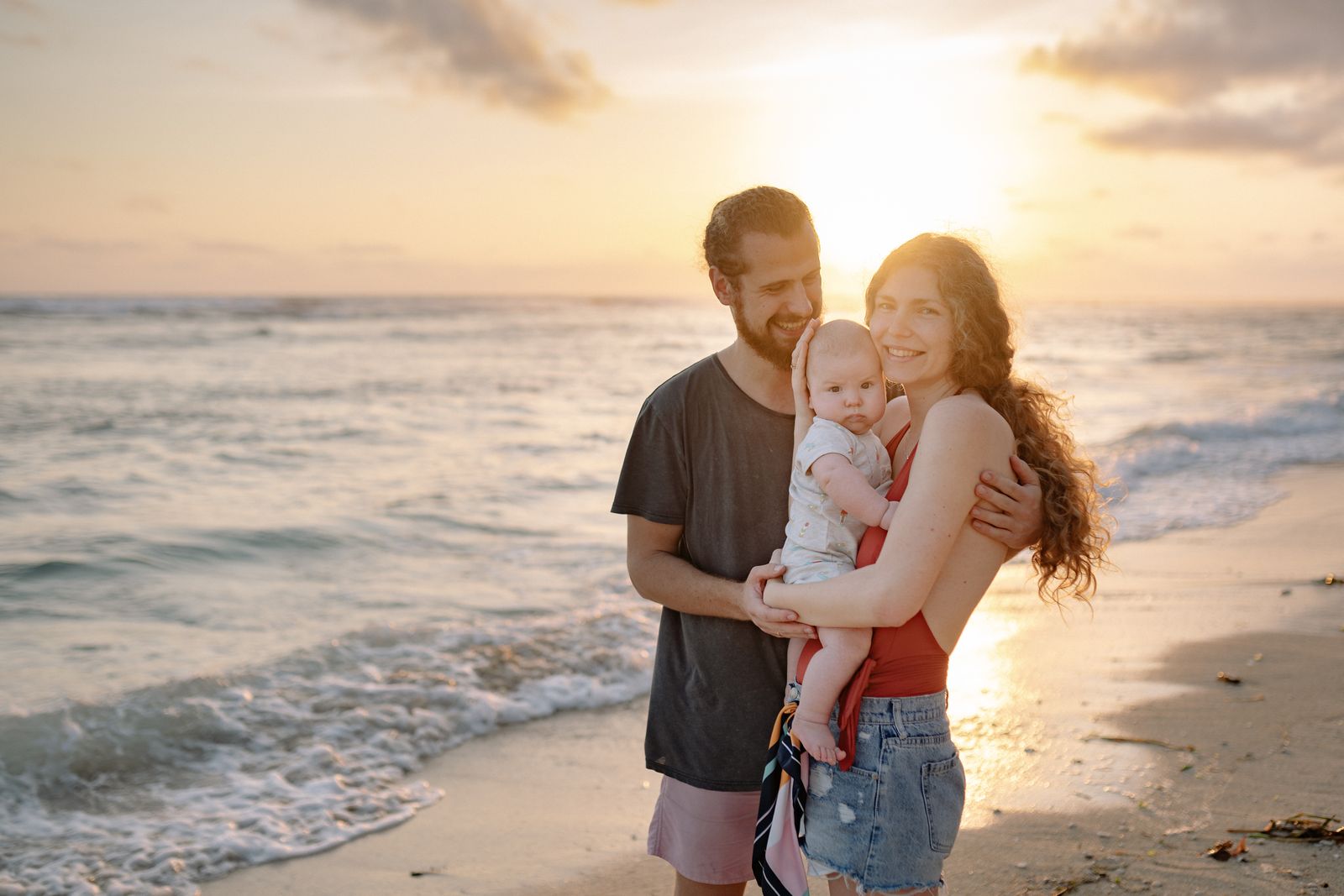 A young family enjoying a beach holiday with their baby at a Red Sea resort